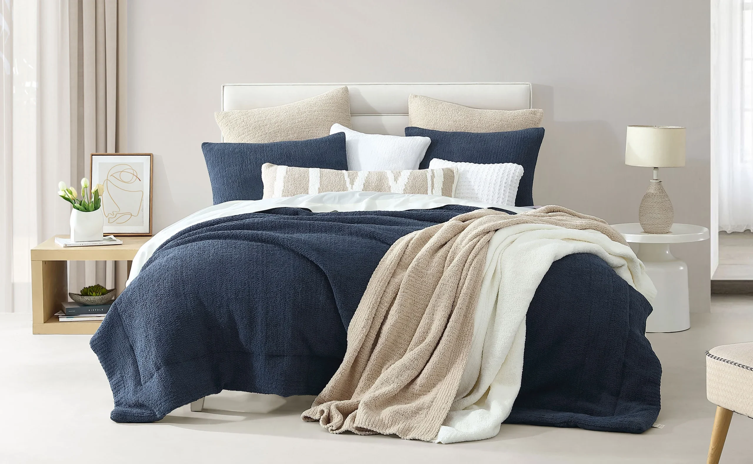 how to style a messy bed with layered blankets and pillows